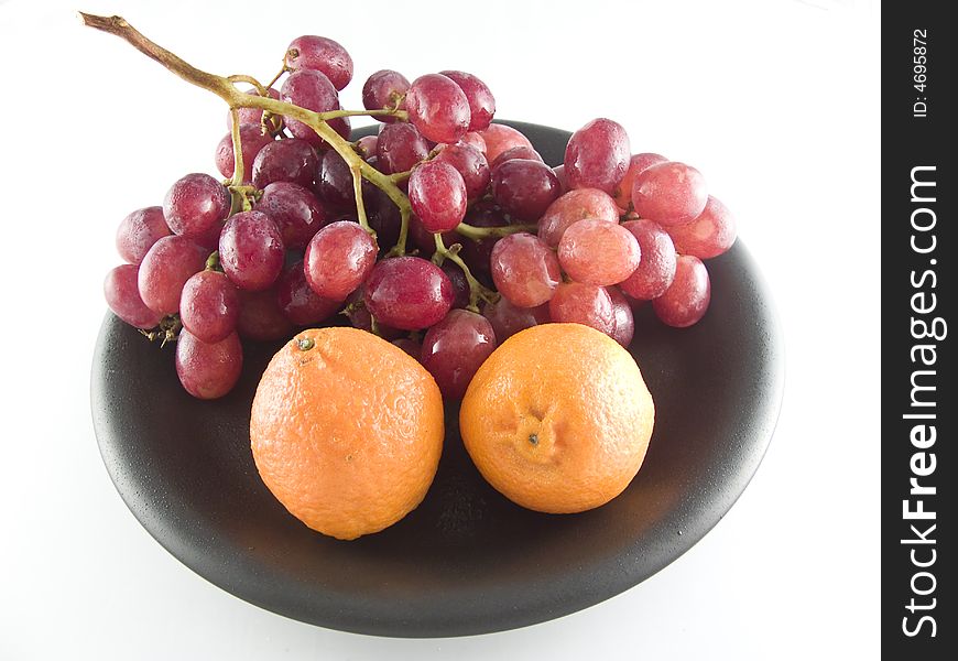 Grapes and mandarines isolated on white background. Grapes and mandarines isolated on white background