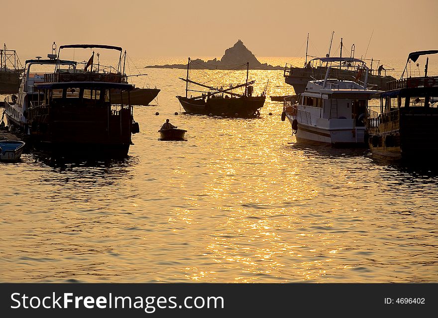 The fisher is in the Sunset of the sea