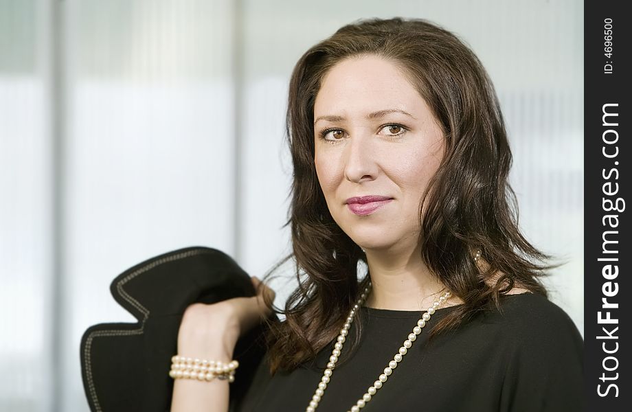 Confident Hispanic Woman Wearing pearls