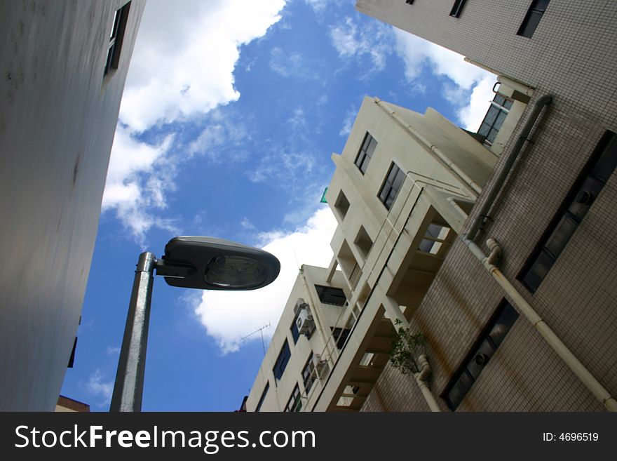 Took this picture at a back alley in Singapore, looking up to the blue sky. Took this picture at a back alley in Singapore, looking up to the blue sky.