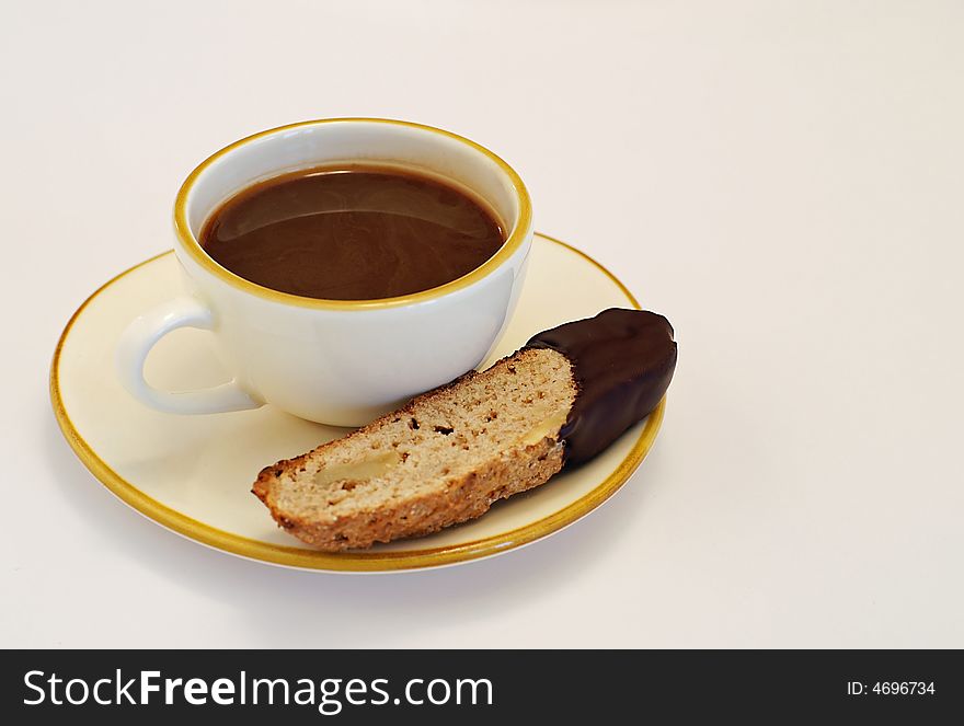 Time out for walnut biscotti dipped in a cup of espresso coffee. Time out for walnut biscotti dipped in a cup of espresso coffee.