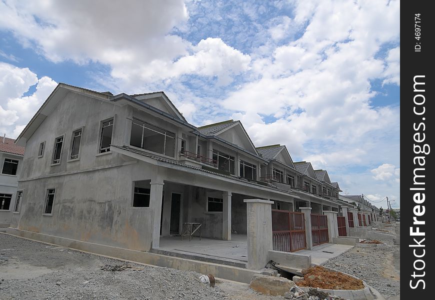 A row of terrace houses under construction as seen on a cloudy day
