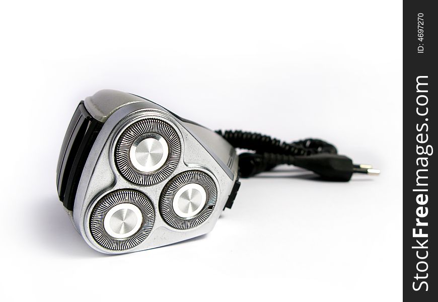 A silver and black electric shave machine, in white background. A silver and black electric shave machine, in white background.