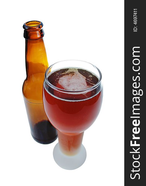 Glass of a German lager beer with a bottle, isolated on white.  Clipping path is included. Glass of a German lager beer with a bottle, isolated on white.  Clipping path is included.