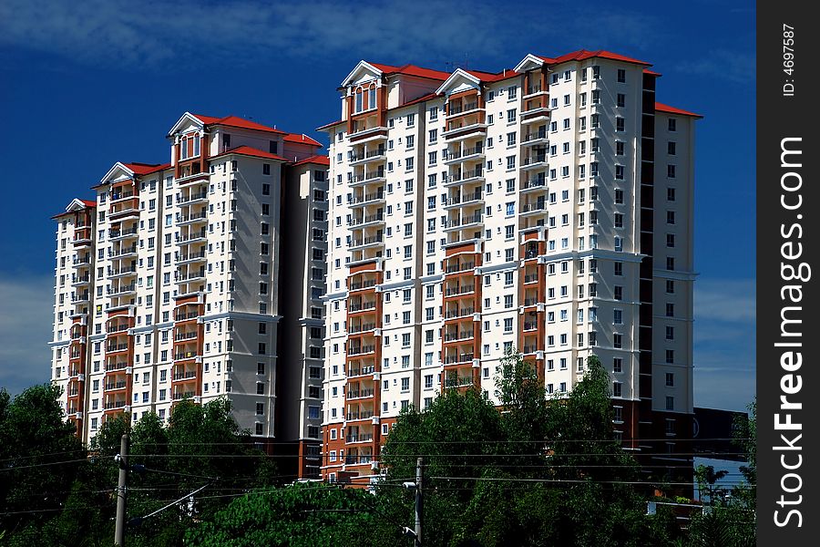 Highrise apartment image on the blue sky background