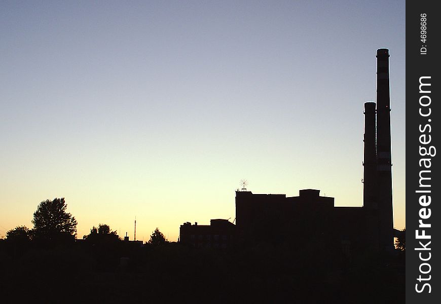 Factory in view of a sunset