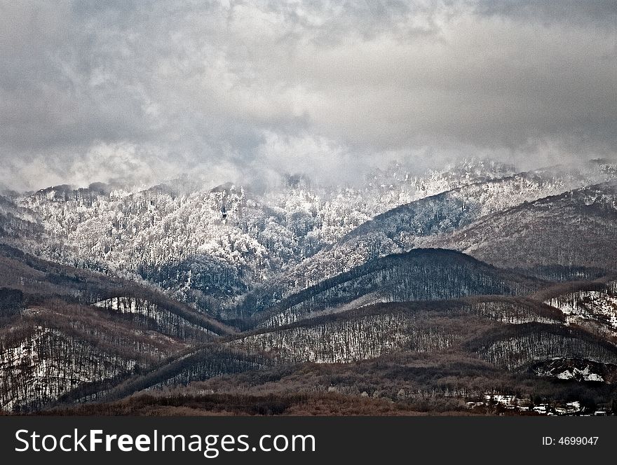 Mountain in winter with snow and clouds. Mountain in winter with snow and clouds