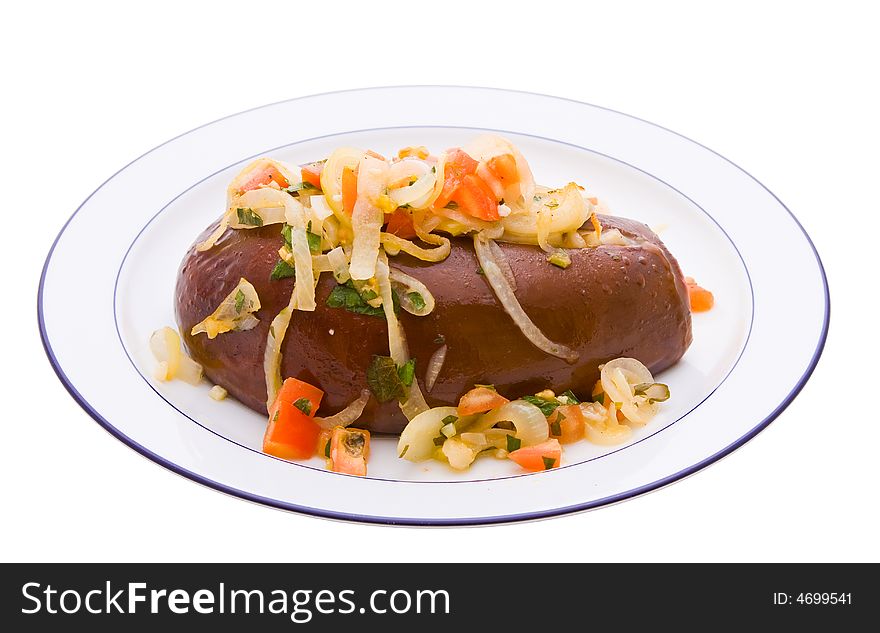 An cooked Aubergine or eggplant with vegetables against a white background