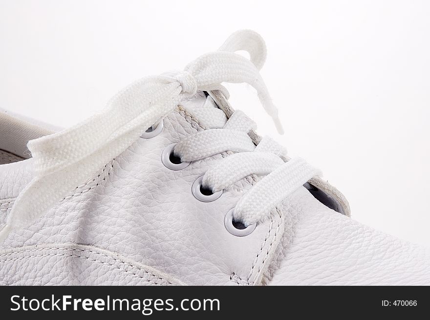 A side view of a shoe, close up on the laces. A side view of a shoe, close up on the laces