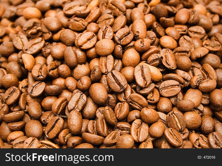 Texture shot of brown coffee beans. Texture shot of brown coffee beans.