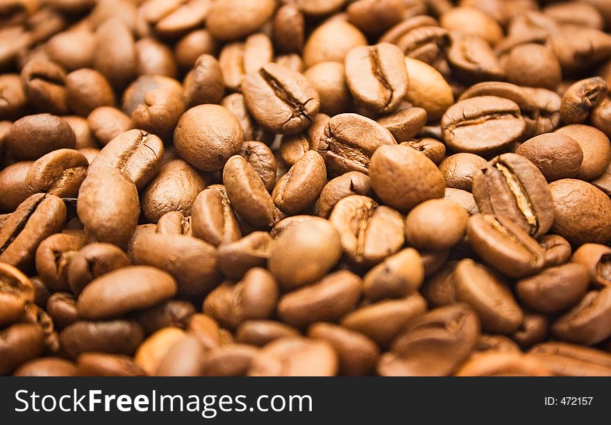 Texture shot of brown coffee beans. Texture shot of brown coffee beans.