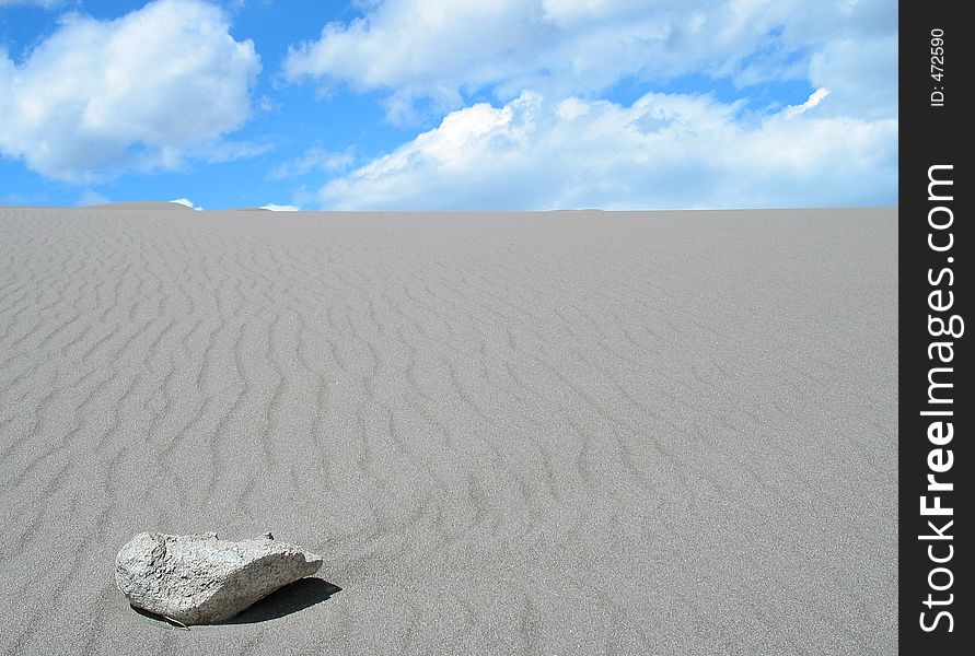 Stone alone in the sand. Stone alone in the sand.