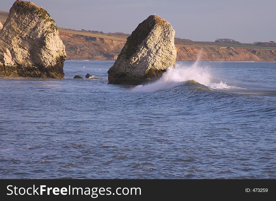 Wave crashing on rocks