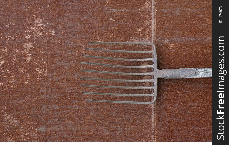 Old rusty hay-fork