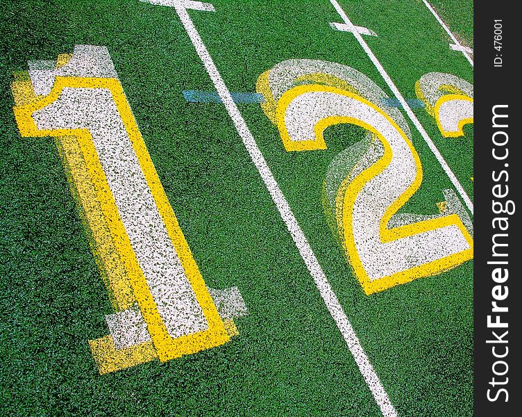 Numbers on a Green running track.