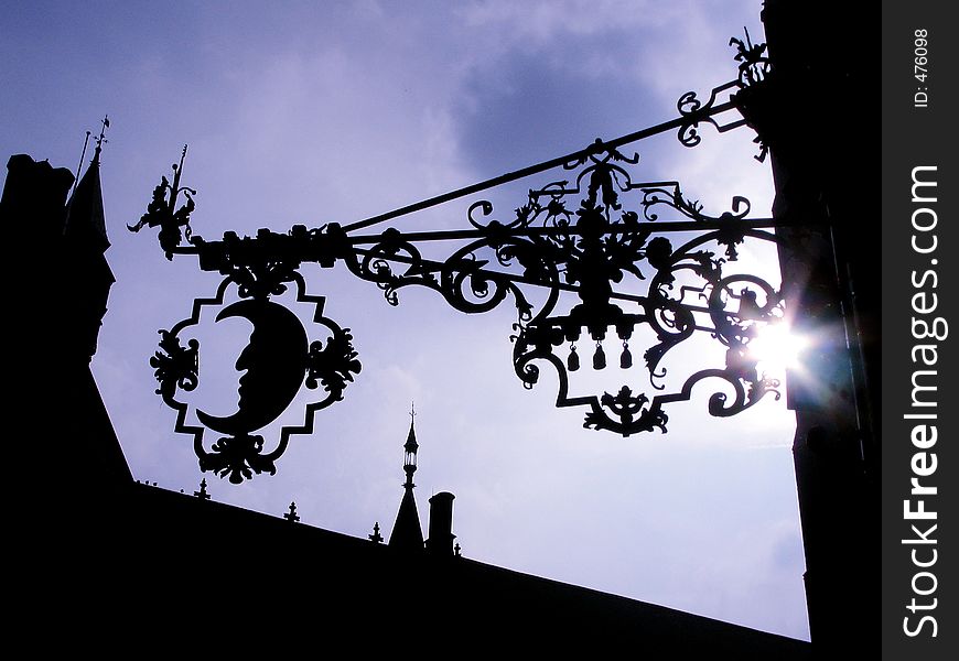 Moon Ironwork on the side of a building in Brugge, Belgium