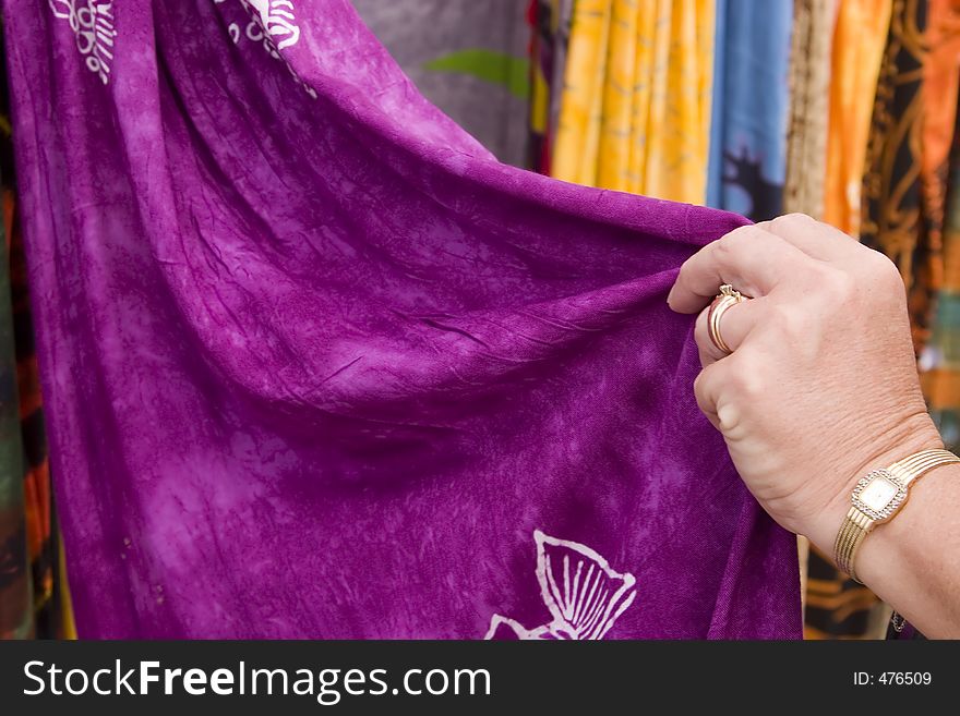 Woman touching fabric. Woman touching fabric