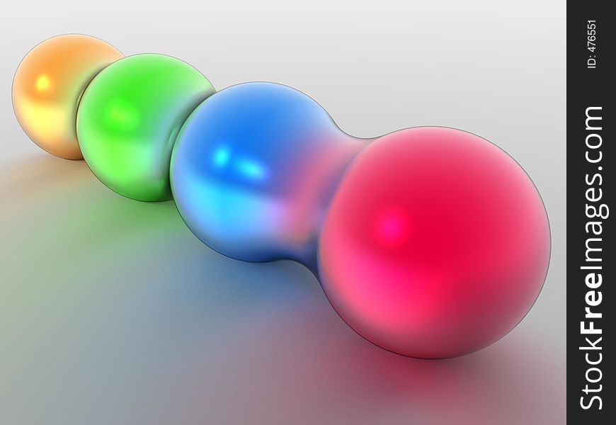 Four different colored spheres morphing together. Four different colored spheres morphing together.