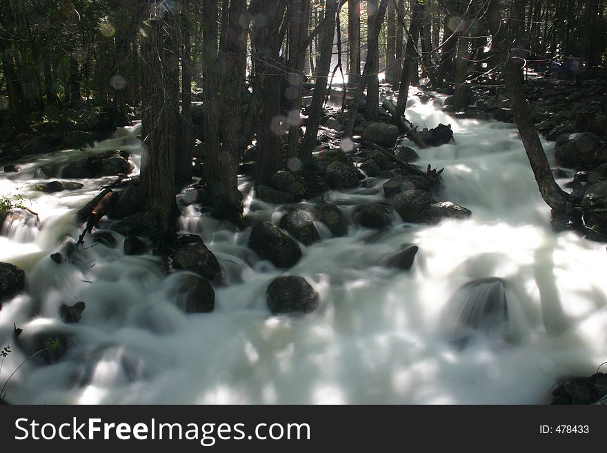 Overflowing stream caused by melting snow in Yosemite National Park, California, U.S.A.