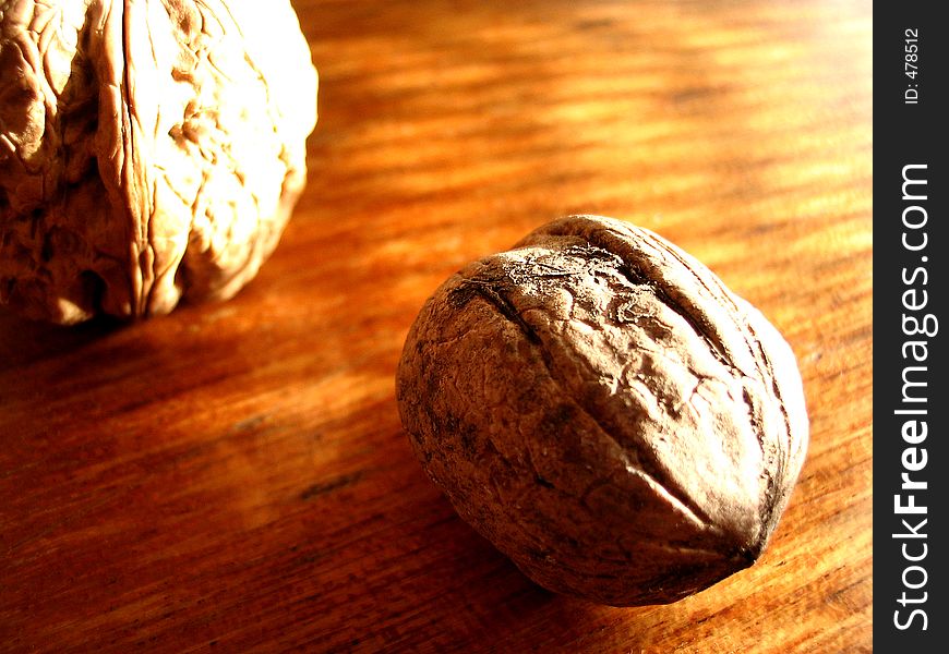 Pair of nuts on wooden table