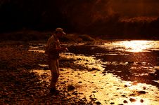 Fisherman On Sunset Stock Photo