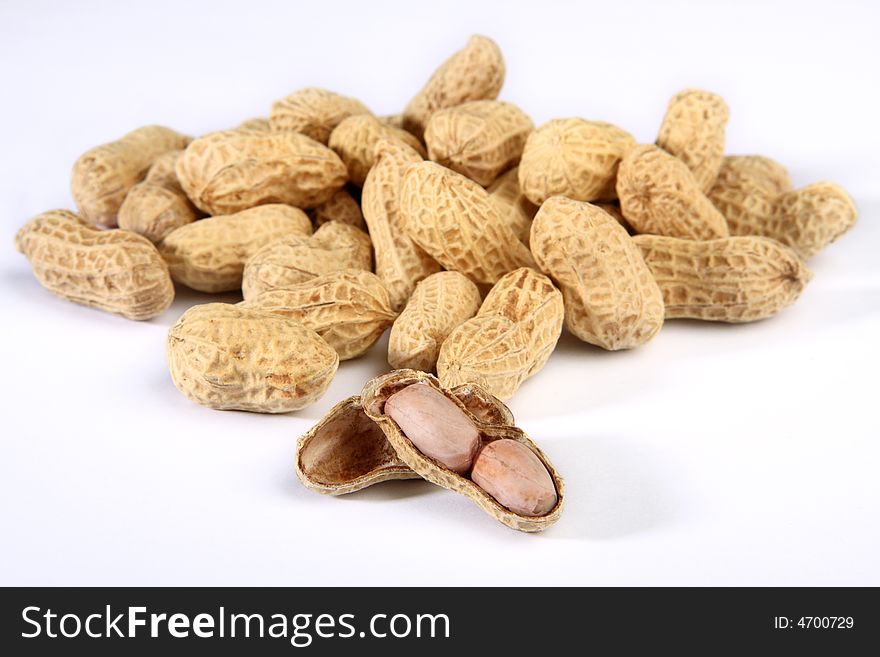 Pile of peanuts isolated on white background. Pile of peanuts isolated on white background