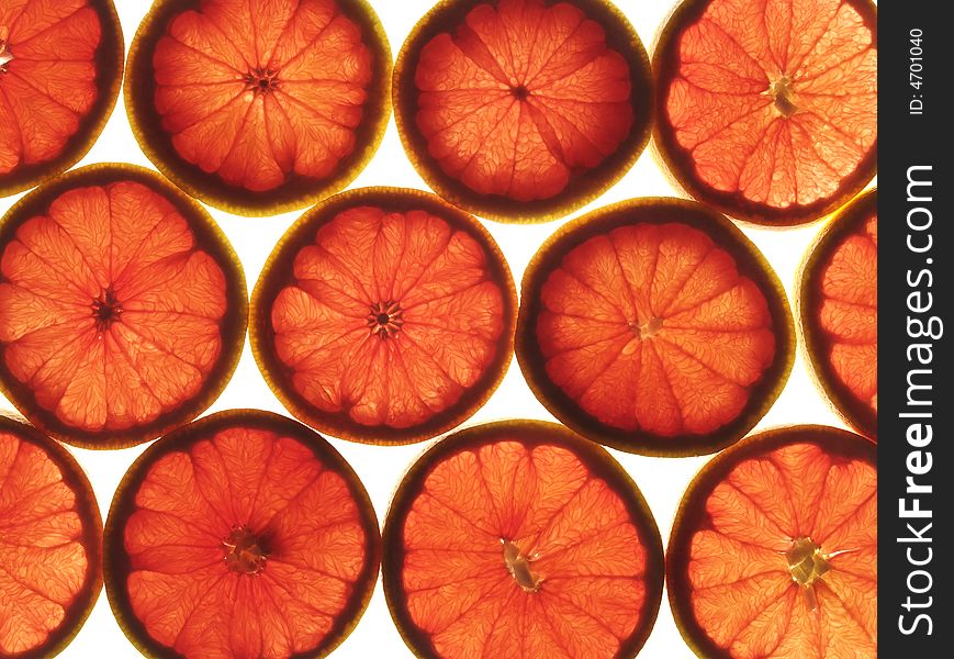 Slices of grapefruit on white background. Slices of grapefruit on white background