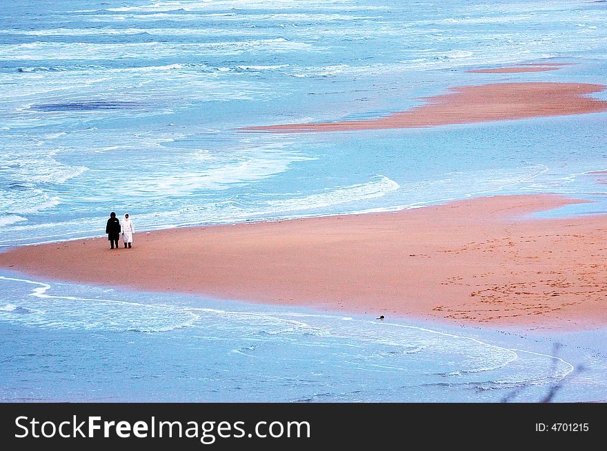 Take a walk a pair of the sweethearts seashore in winter. Take a walk a pair of the sweethearts seashore in winter