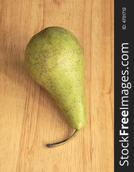 Conference pear on a wooden board