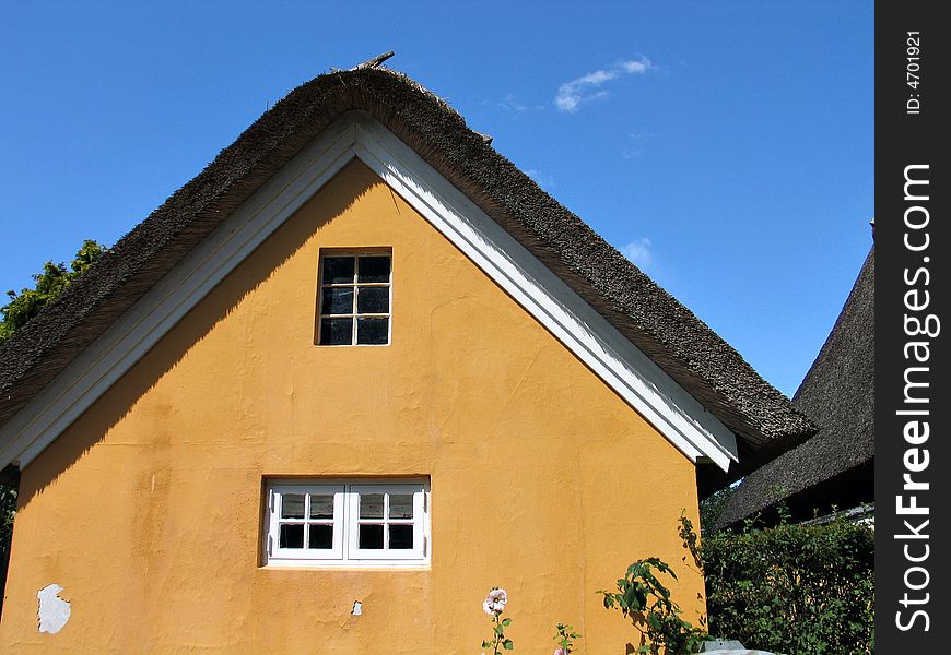 Typical country house with old style thatched straw roof in Denmark. Typical country house with old style thatched straw roof in Denmark