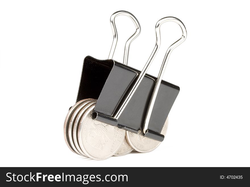 Coins clamped by a paper clip isolated on a white background. Clipping path included.