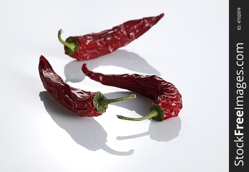 Chilies on white background with shadows