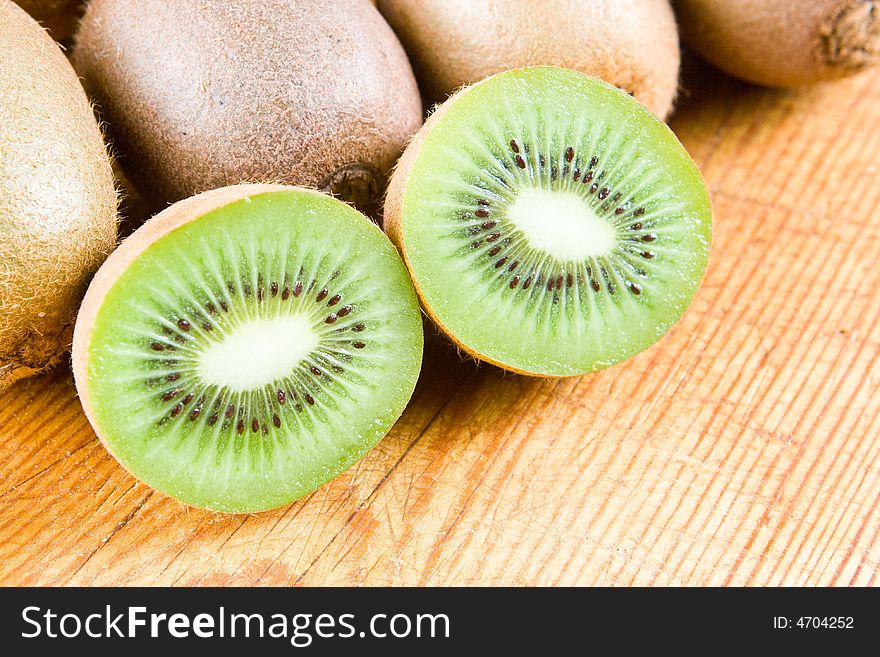 Kiwi halves on a wooden board