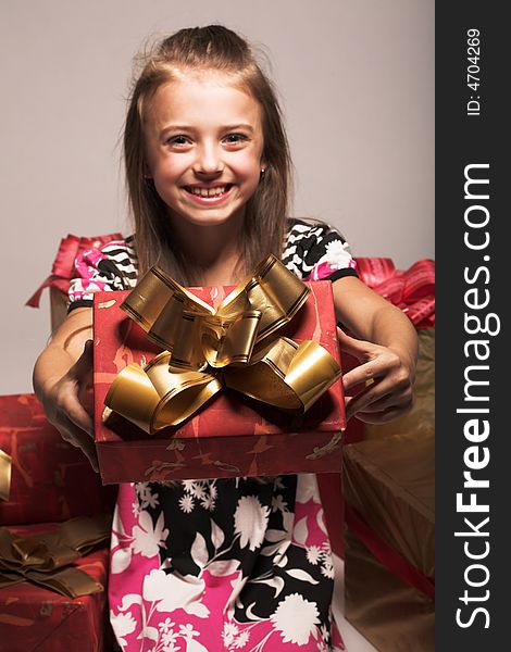 Laughing girl carrying xmas presents. Laughing girl carrying xmas presents.