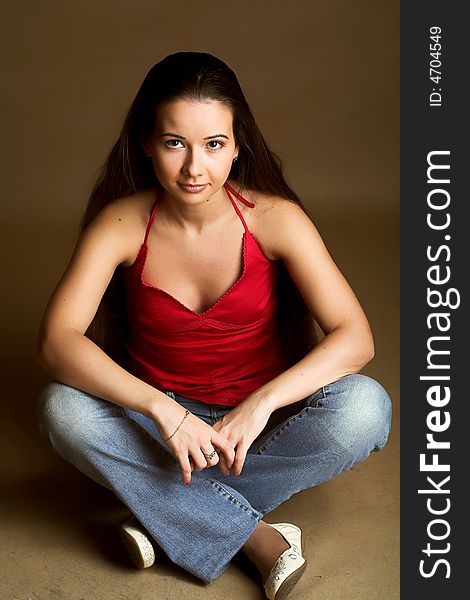 Girl in jeans and red top with long hair. Girl in jeans and red top with long hair