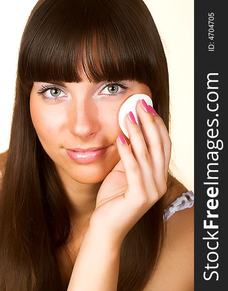 Portrait of brunette young sexy woman doing makeup isolated on white background. Portrait of brunette young sexy woman doing makeup isolated on white background