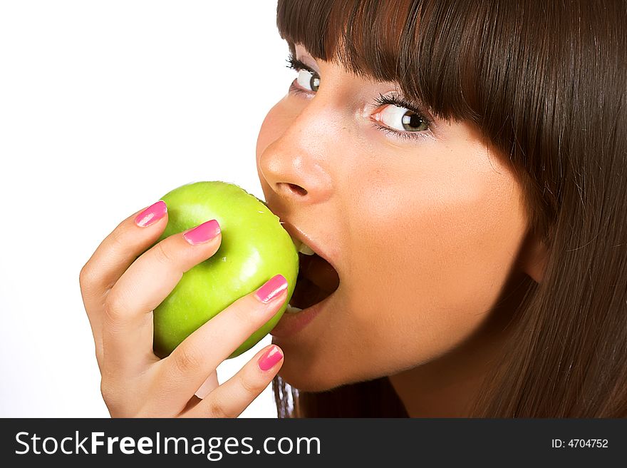 Close-up portrait of young girl eating green apple isolated on white background. Close-up portrait of young girl eating green apple isolated on white background