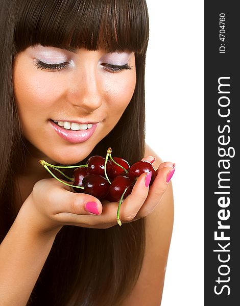 Brunette holding cherries, close-up portrait, isolated on white background