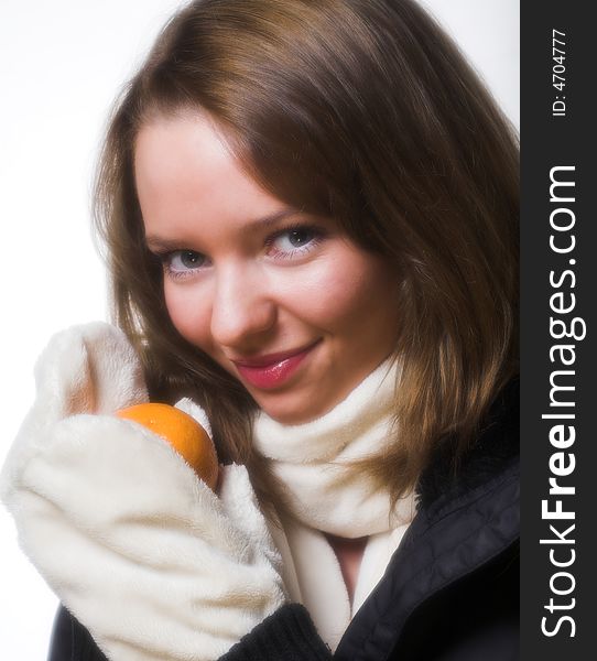 Smiling model posing in winter clothes.