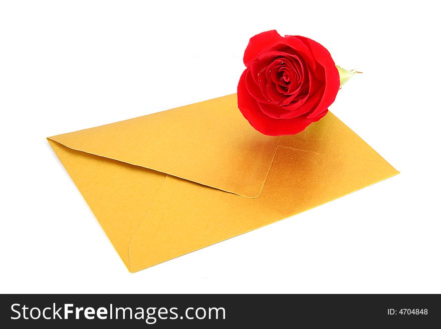 Rose and a gold envelope isolated on white background. Rose and a gold envelope isolated on white background