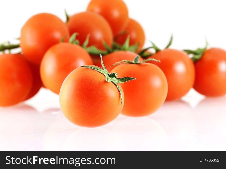 A lot of nice fresh juicy tomatos over white