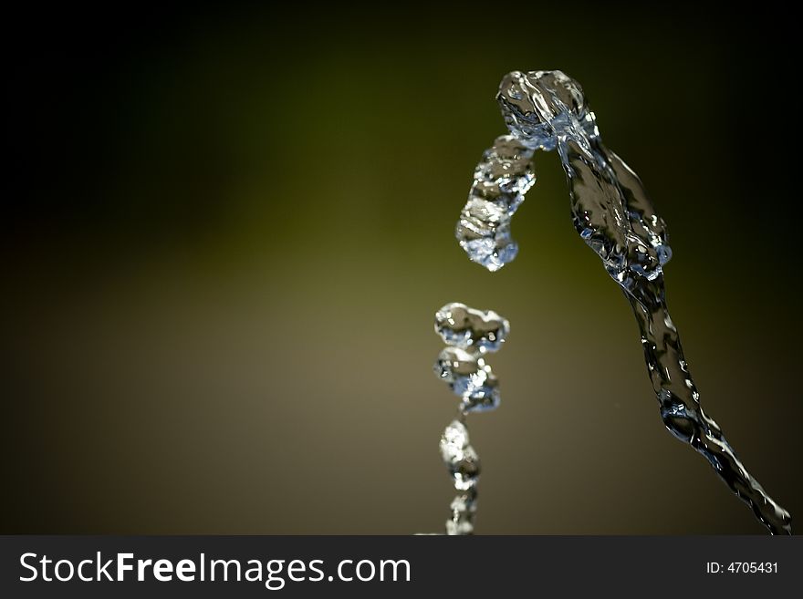 Water jet over isolated background