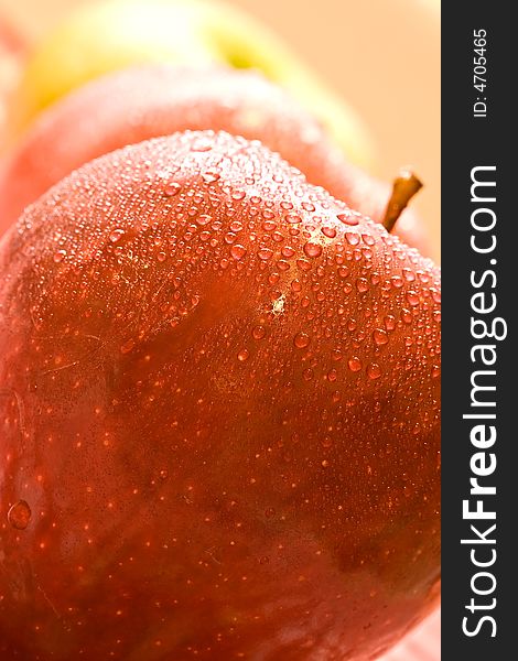 Macro shot of fresh ripe apples washed with water