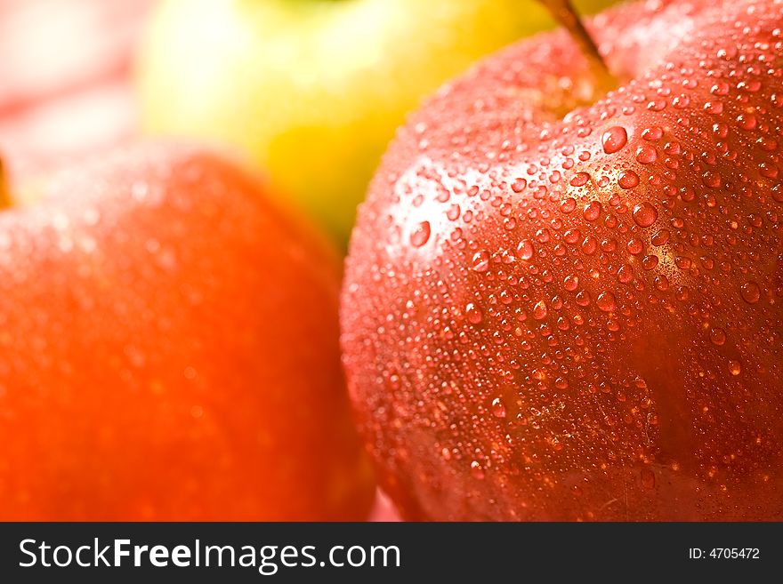 Macro shot of fresh ripe apples washed with water