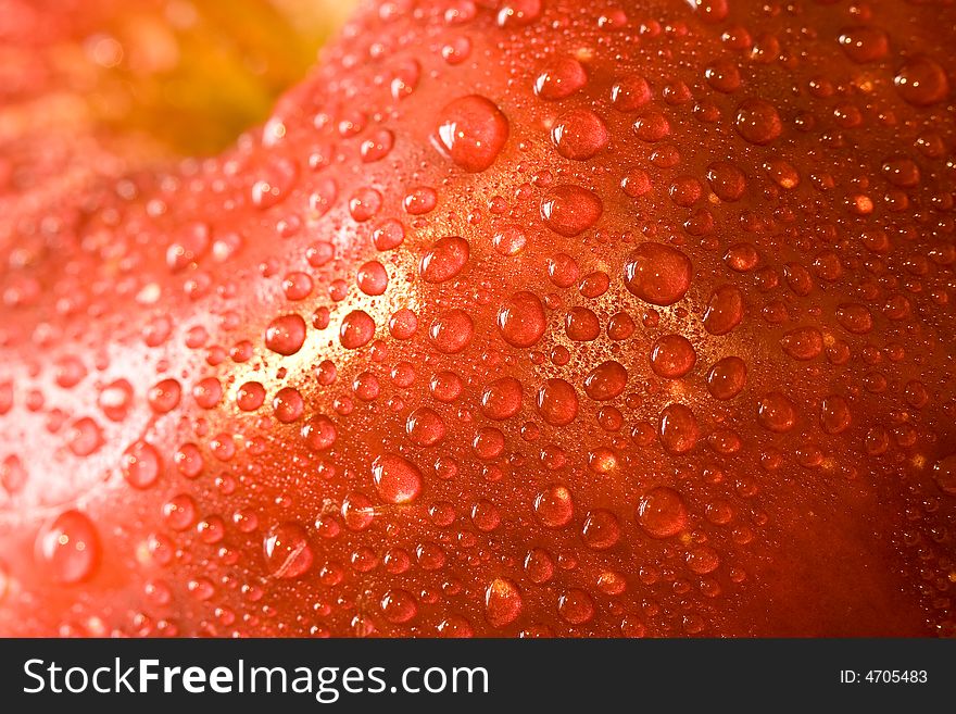 Macro shot of fresh ripe apples washed with water