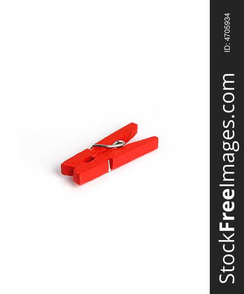 Red wooden clamp clothes on a white background.