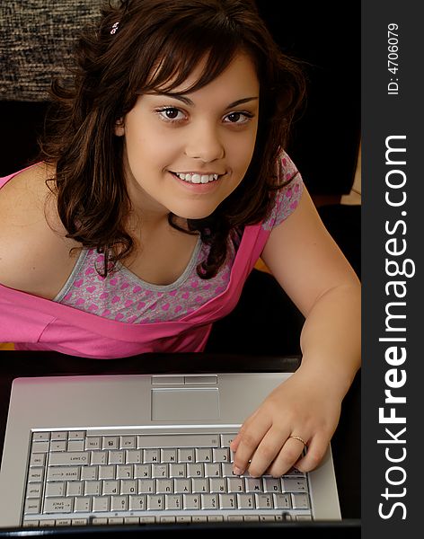 Teenage girl with laptop computer