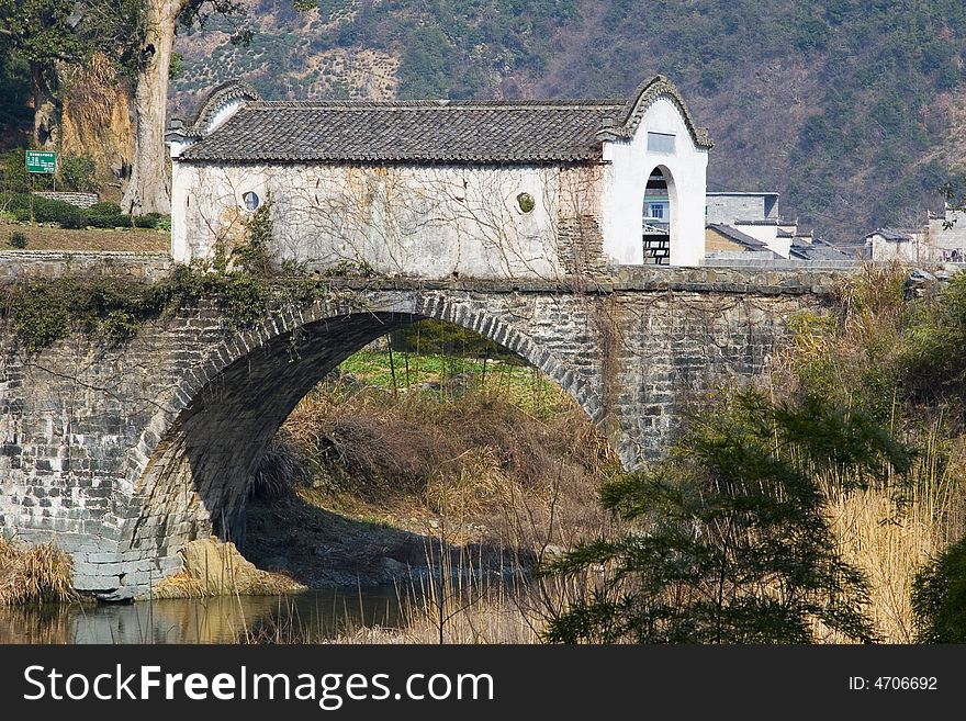 A beautiful old stone bridge in rural China. A beautiful old stone bridge in rural China