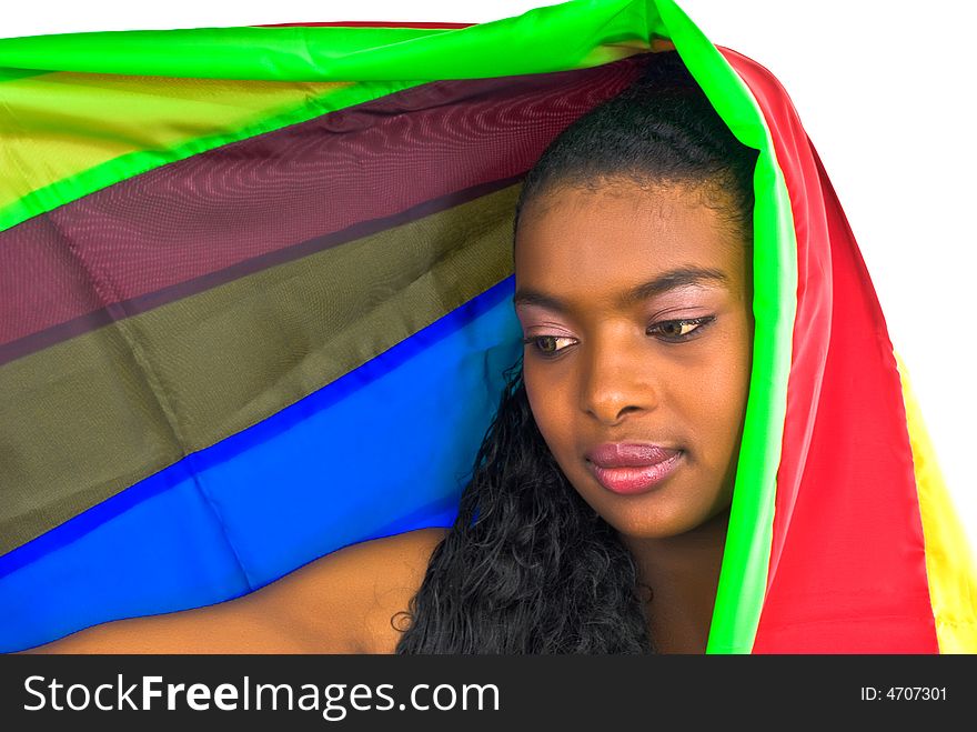 Attractive pretty african girl wrapped in a colorful shawl