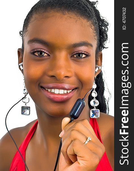 Delighted young african girl playing with a hands-free set